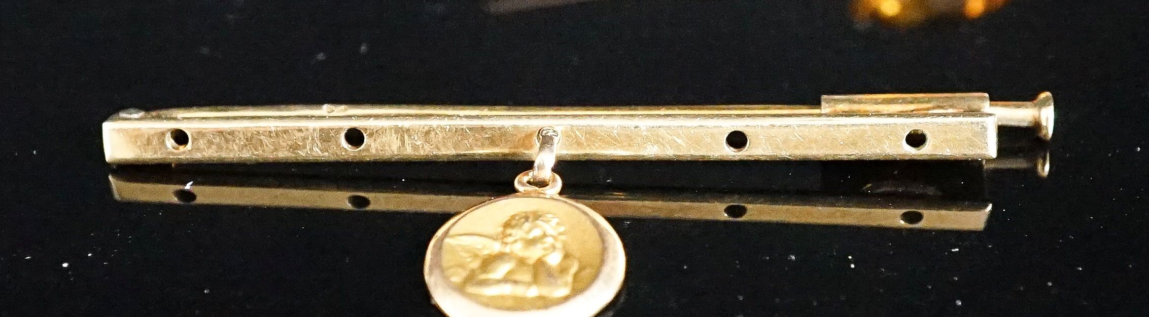 A yellow metal, single stone citrine and two stone diamond set bar brooch, 56mm and one other with cherub pendant charm, gross 6.3 grams.